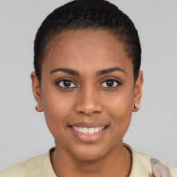 Joyful black young-adult female with short  brown hair and brown eyes