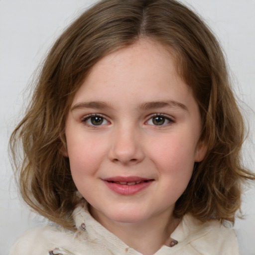 Joyful white child female with medium  brown hair and brown eyes