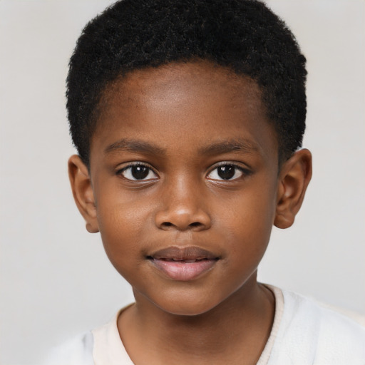 Joyful black child male with short  brown hair and brown eyes