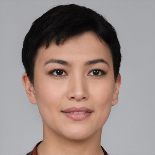 Joyful asian young-adult female with short  black hair and brown eyes
