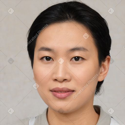 Joyful asian young-adult female with medium  black hair and brown eyes