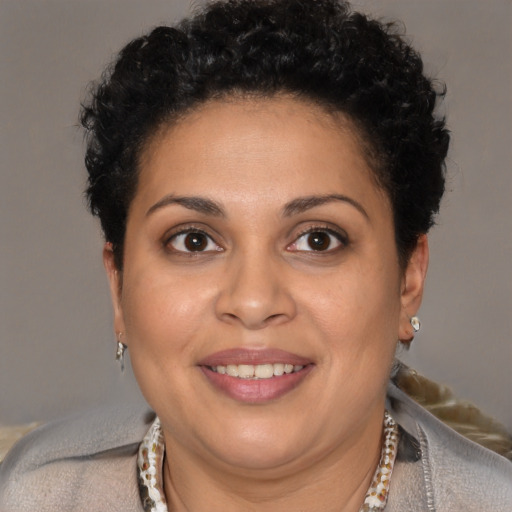 Joyful white adult female with short  brown hair and brown eyes