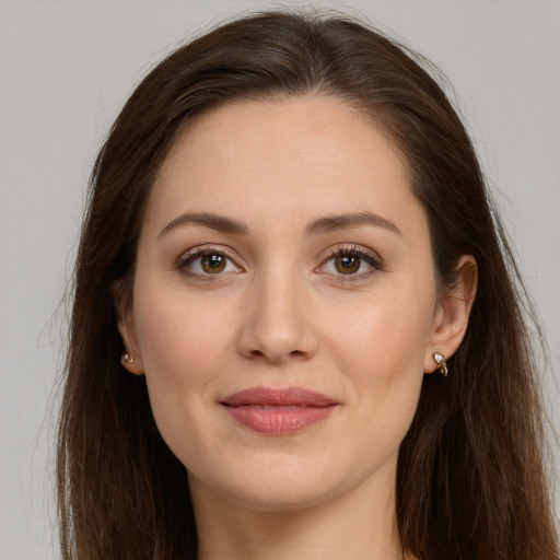 Joyful white young-adult female with long  brown hair and grey eyes