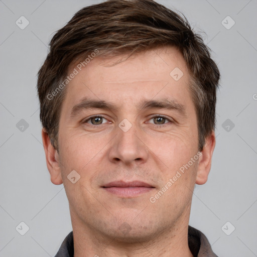 Joyful white adult male with short  brown hair and grey eyes