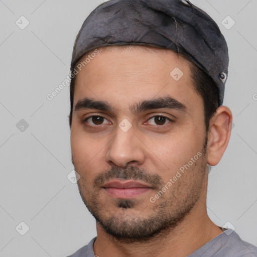 Joyful white young-adult male with short  black hair and brown eyes