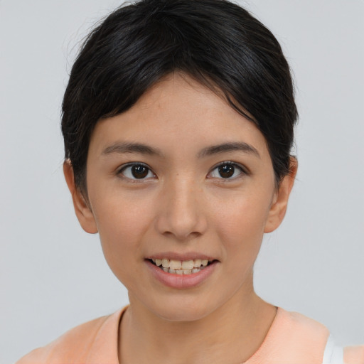 Joyful asian young-adult female with short  brown hair and brown eyes