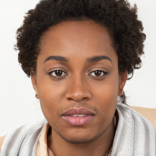 Neutral black young-adult female with short  brown hair and brown eyes