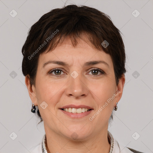 Joyful white adult female with short  brown hair and grey eyes