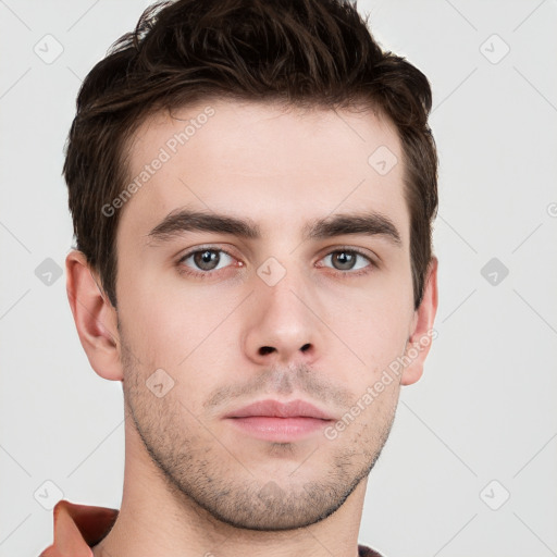 Neutral white young-adult male with short  brown hair and grey eyes