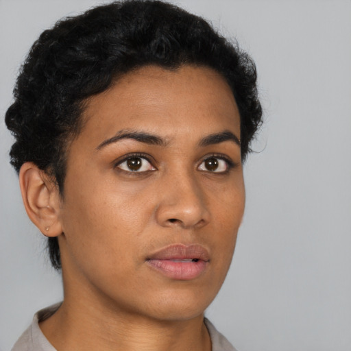 Neutral latino young-adult female with short  black hair and brown eyes