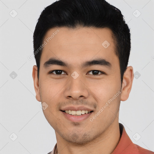 Joyful asian young-adult male with short  black hair and brown eyes