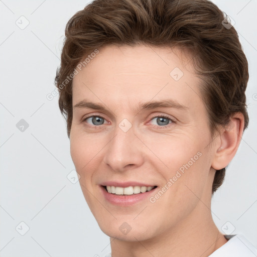 Joyful white young-adult female with short  brown hair and grey eyes