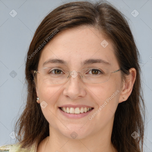 Joyful white adult female with long  brown hair and brown eyes