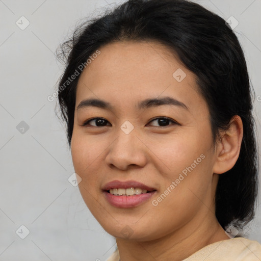 Joyful asian young-adult female with medium  brown hair and brown eyes