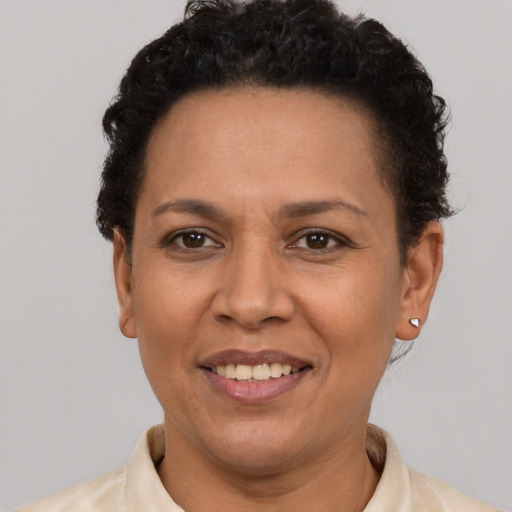 Joyful latino adult female with short  brown hair and brown eyes