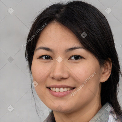 Joyful asian young-adult female with medium  brown hair and brown eyes