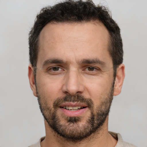 Neutral white young-adult male with short  black hair and brown eyes