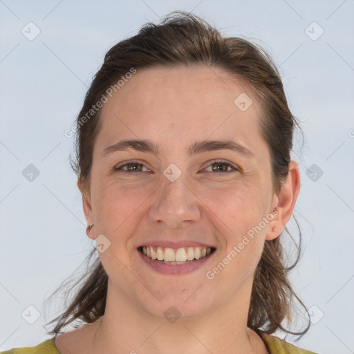 Joyful white adult female with medium  brown hair and brown eyes