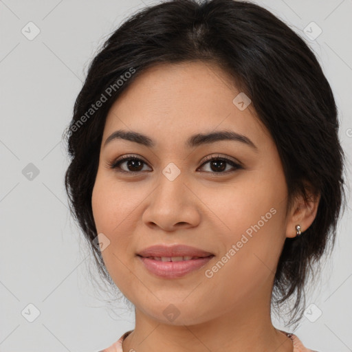 Joyful asian young-adult female with long  brown hair and brown eyes