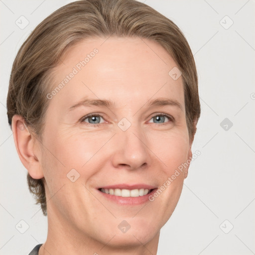 Joyful white adult female with short  brown hair and grey eyes