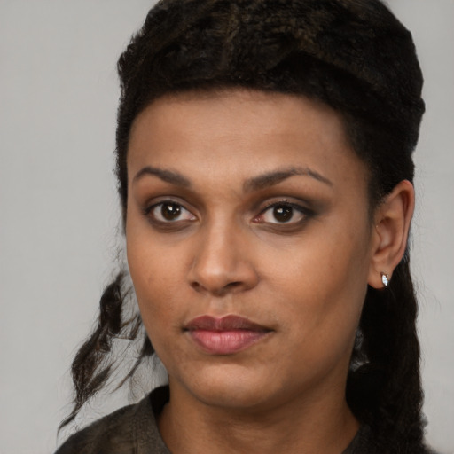 Neutral black young-adult female with long  black hair and brown eyes