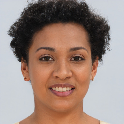 Joyful latino young-adult female with short  brown hair and brown eyes