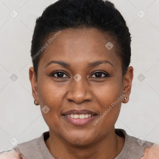 Joyful black adult female with short  brown hair and brown eyes