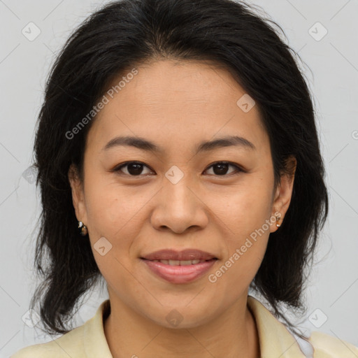 Joyful white adult female with medium  brown hair and brown eyes