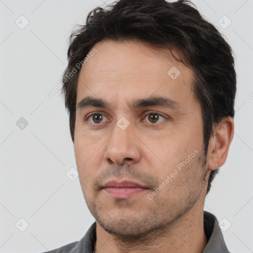 Neutral white adult male with short  black hair and brown eyes