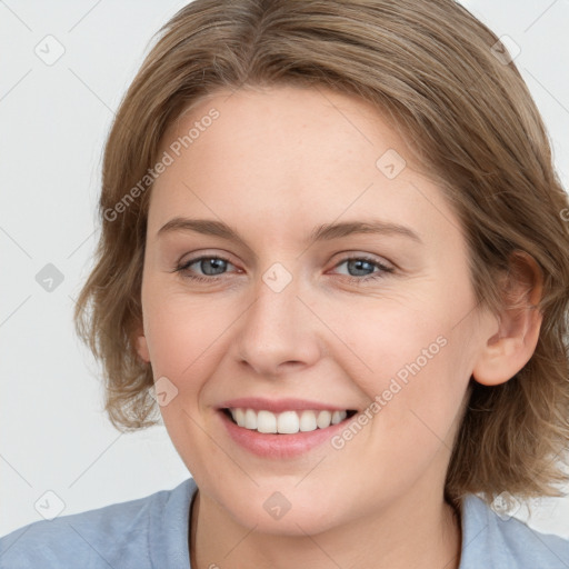 Joyful white young-adult female with medium  brown hair and blue eyes