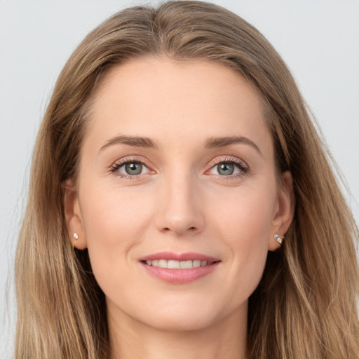 Joyful white young-adult female with long  brown hair and grey eyes