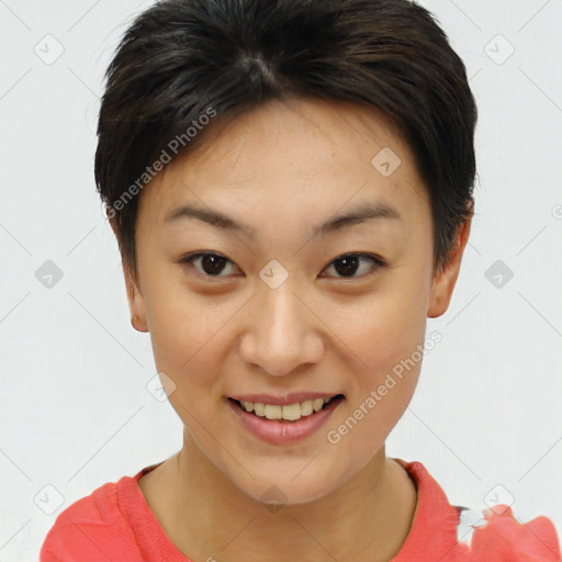 Joyful asian young-adult female with short  brown hair and brown eyes