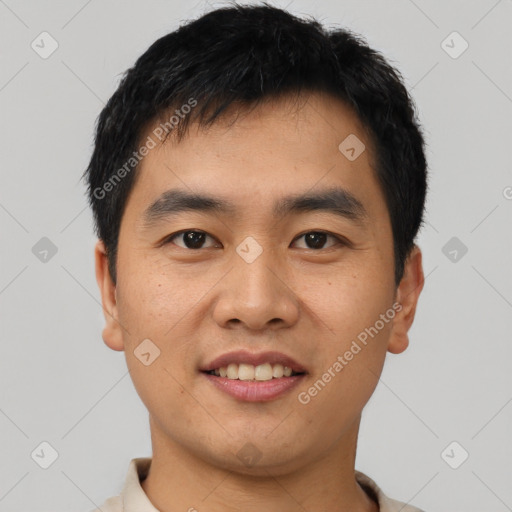 Joyful asian young-adult male with short  black hair and brown eyes