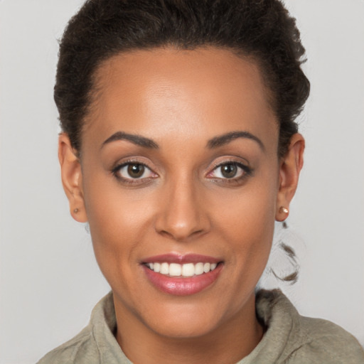 Joyful white young-adult female with short  brown hair and brown eyes