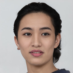 Joyful asian young-adult female with short  black hair and brown eyes