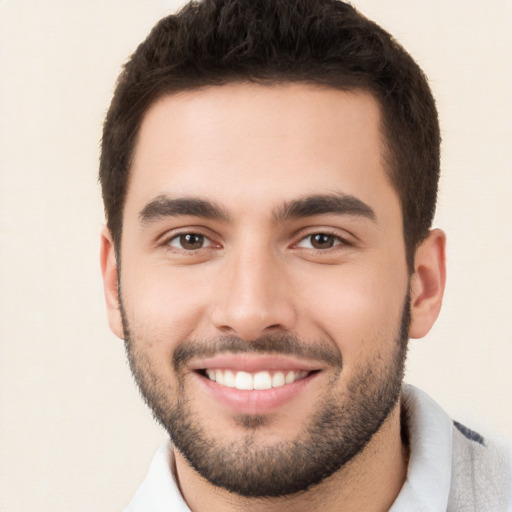 Joyful white young-adult male with short  brown hair and brown eyes