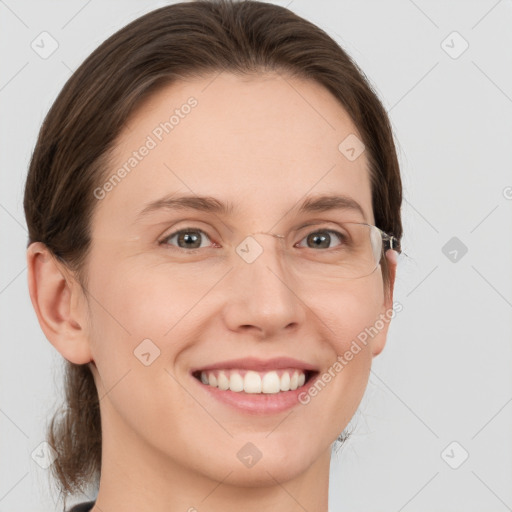 Joyful white young-adult female with medium  brown hair and grey eyes