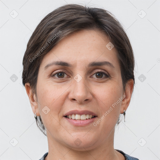 Joyful white adult female with short  brown hair and grey eyes