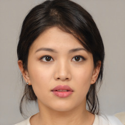 Neutral asian young-adult female with medium  brown hair and brown eyes