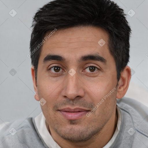 Joyful white young-adult male with short  black hair and brown eyes