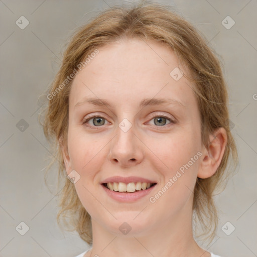 Joyful white young-adult female with medium  brown hair and blue eyes