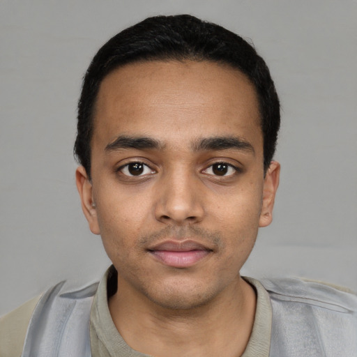Neutral latino young-adult male with short  black hair and brown eyes