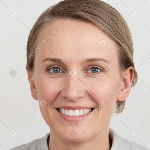 Joyful white young-adult female with medium  brown hair and blue eyes