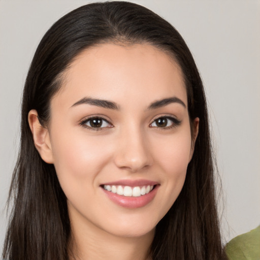 Joyful white young-adult female with long  brown hair and brown eyes