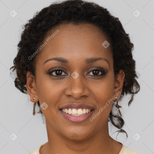 Joyful black young-adult female with medium  brown hair and brown eyes