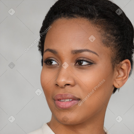 Joyful black young-adult female with short  brown hair and brown eyes