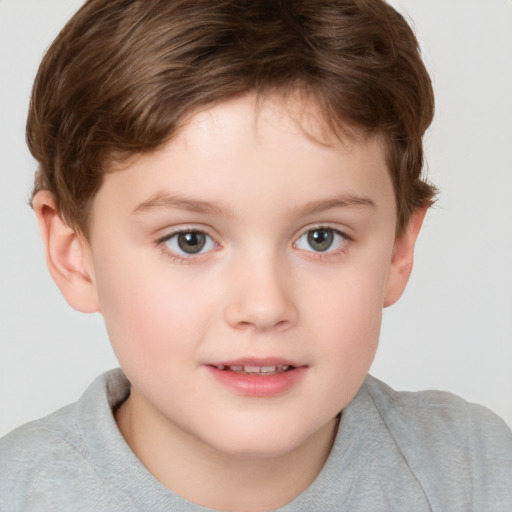 Joyful white child male with short  brown hair and brown eyes