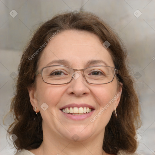 Joyful white adult female with medium  brown hair and blue eyes