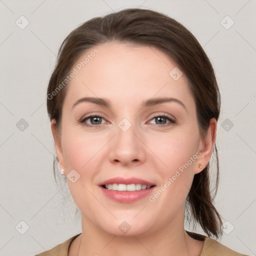 Joyful white young-adult female with medium  brown hair and grey eyes