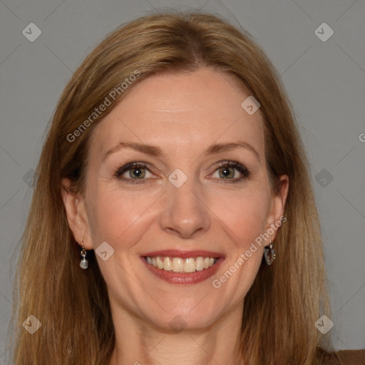 Joyful white adult female with long  brown hair and brown eyes